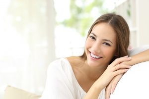 Beauty woman with white perfect smile looking happy near reigate dental centre surrey