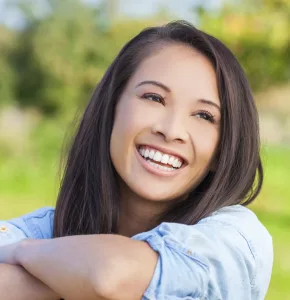 Woman smiling and looking off into distance