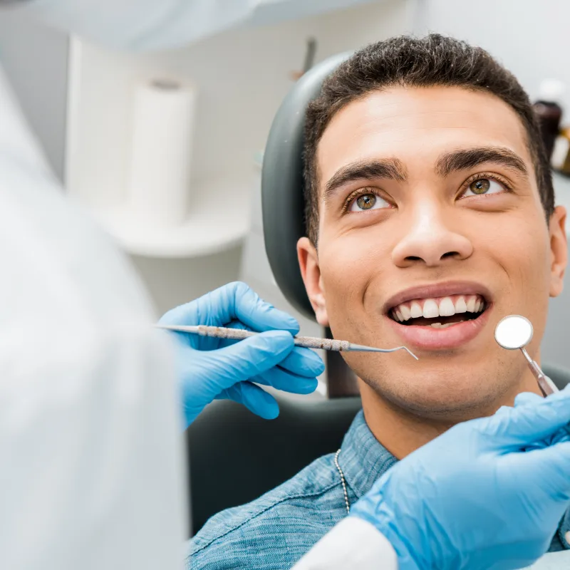 man with during examination in dental