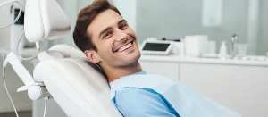 Young man at the dentist in reigate receiving expert dental care